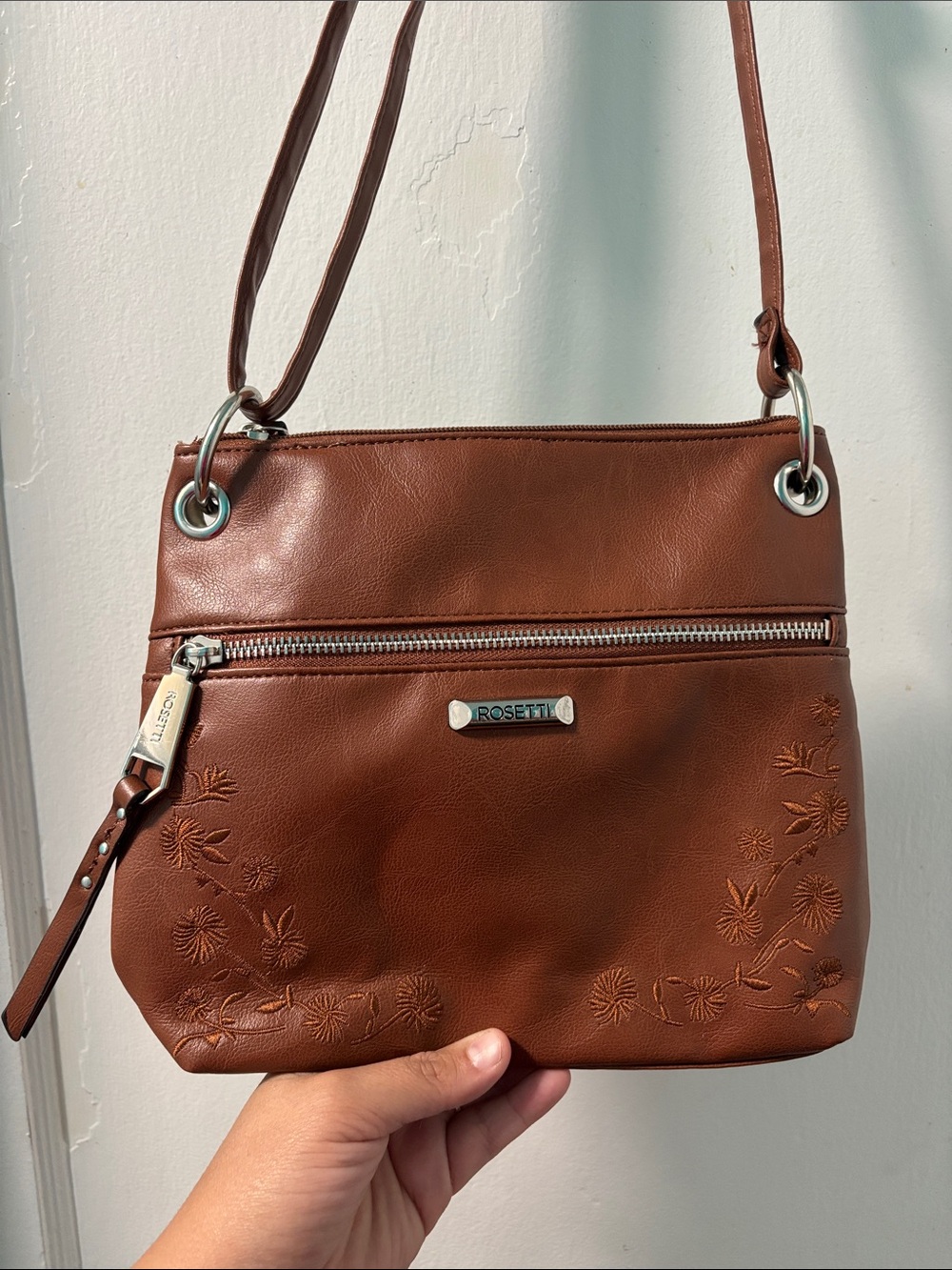 Rosetti Brown Floral-Embossed Crossbody Bag with Silver Hardware